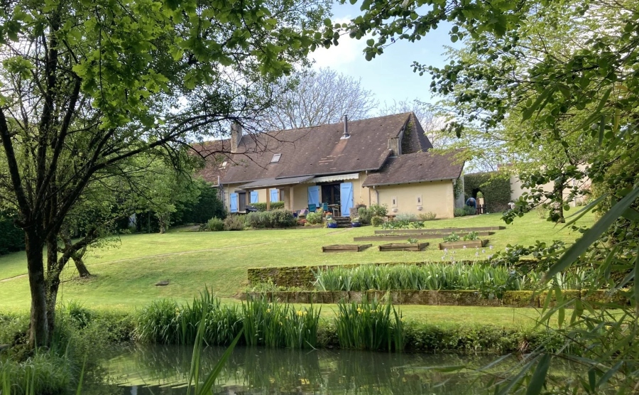 Longère in France with expansive garden, full of greenery and private pond